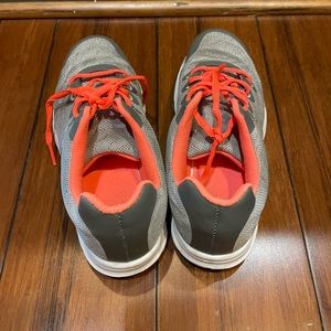 Grey and orange golf shoes